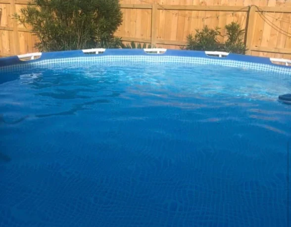 Clear blue above-ground pool after professional service